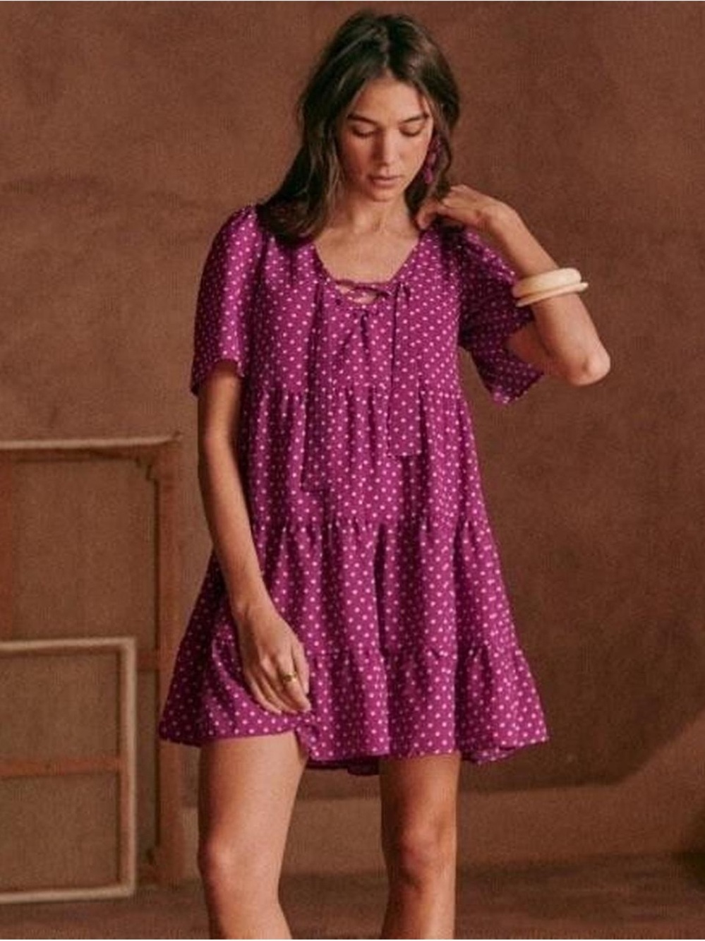Sézane Manoa short tiered dress in a purple polka dot print.